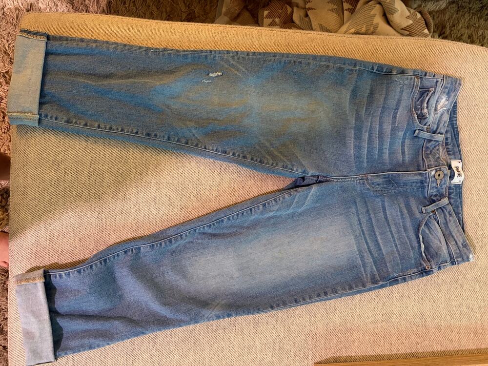 Paige brand jeans with a light wash and distressed details size 28